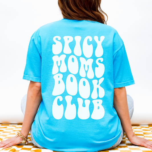 Person wearing a blue t-shirt with 'Spicy Moms Book Club' text on the back.