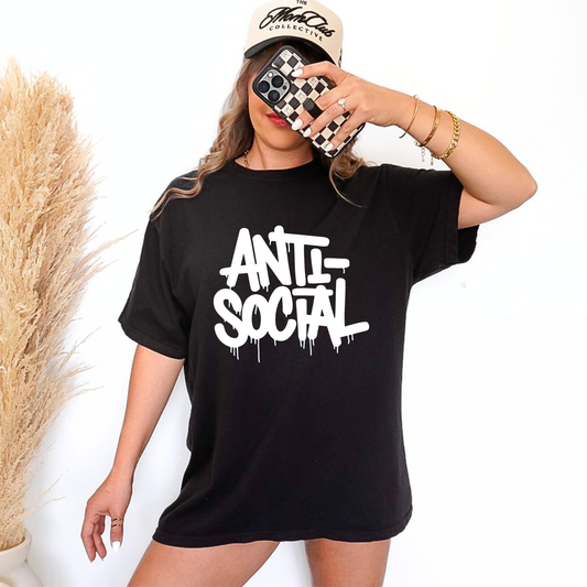black t-shirt with the word anti-social on a white paint drip front