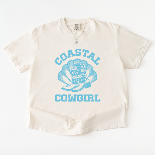 Beige baby romper with blue 'Coastal Cowgirl' text and boot design on a white background